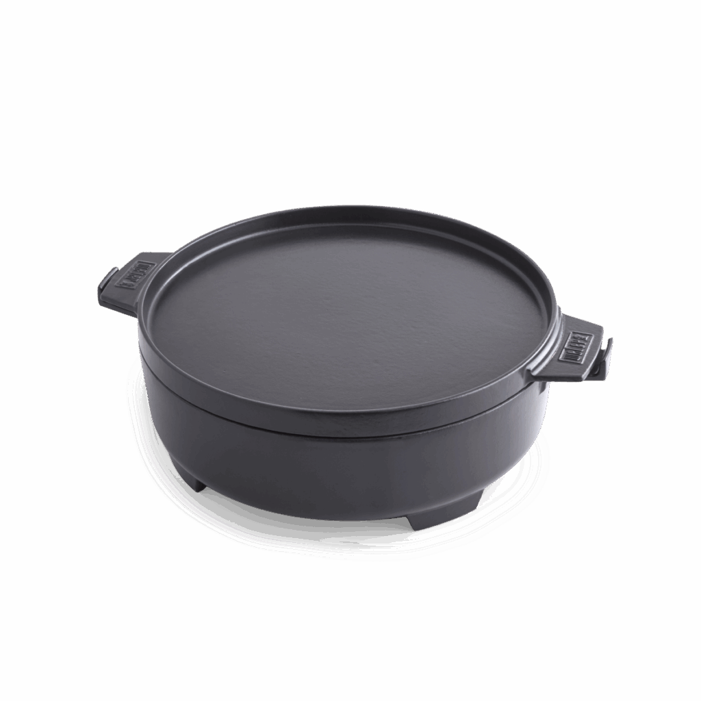 Olla de hierro fundido con tapa negra.